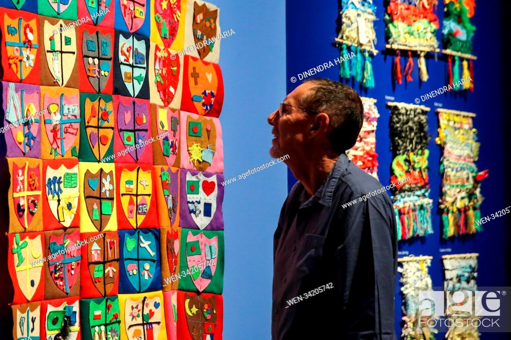 Stock Photo: Visitors attend ""Take One Picture"" exhibition. ""Take One Picture"" at The National Gallery is an exhibition of artworks by primary schoolchildren inspired by.