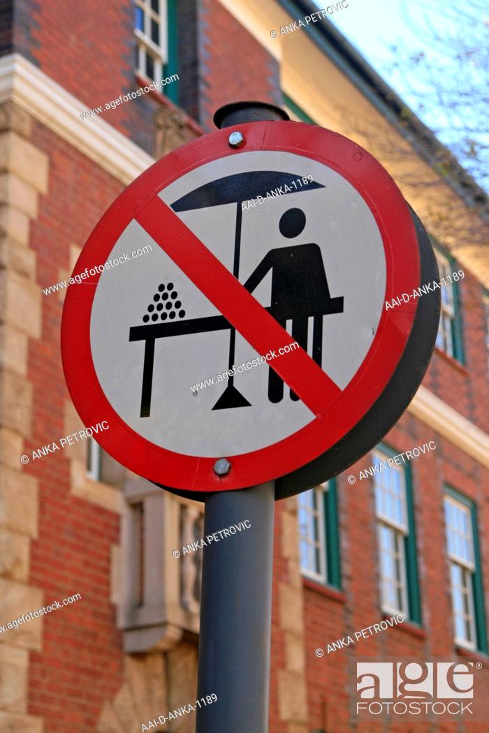 Stock Photo: No hawkers sign on road next to apartment buildings, Braamfontein, Johannesburg, Gauteng, South Africa.