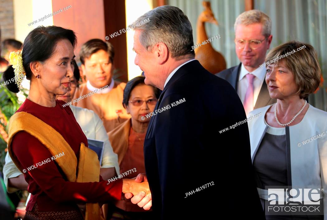 Stock Photo: German President Joachim Gauck and his partner Daniela Schadt (R) bid Burmese opposition politician Aung San Suu Kyi (L) farewell after a meeting in Naypyidaw.