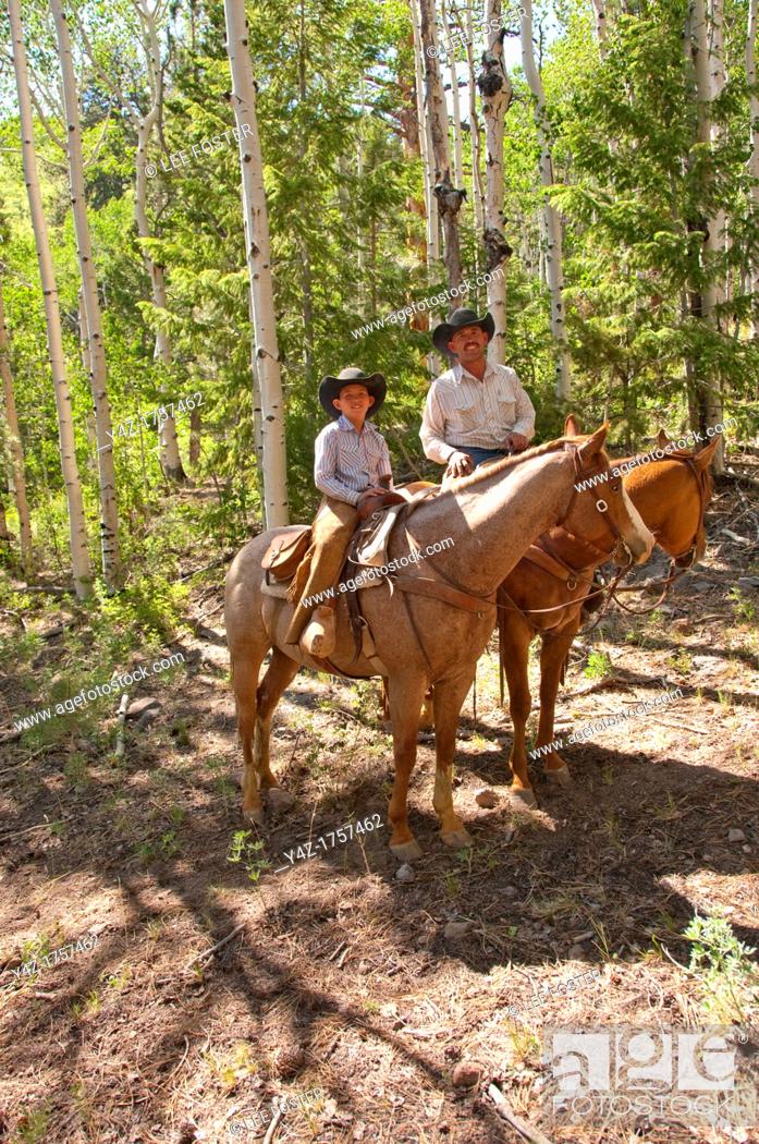 Stock Photo: USA, Utah, horseback ride in Escalante with wranglers Jamie Barnson and Cash Barnson through ponderosa pine forest up steep trail to Aquarius Plateau   MR.