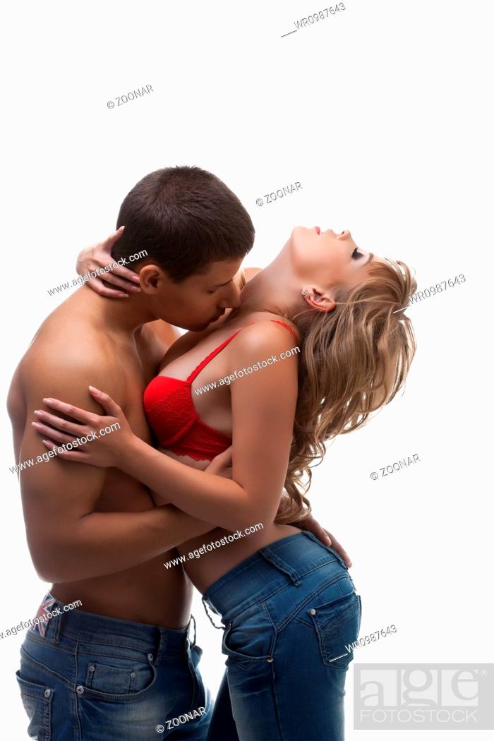 Athletic man kiss sexy girl in bra, Foto de Stock, Imagen Free WR0987643 | agefotostock