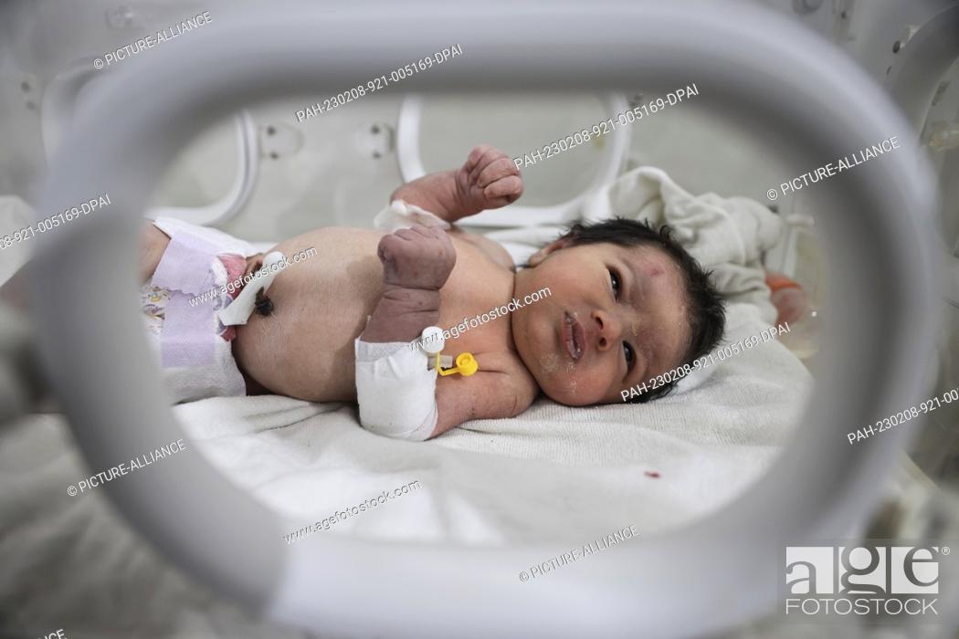 Stock Photo: 08 February 2023, Syria, Afrin: A newborn girl lies inside an incubator as part of her medical checkup at a children's hospital in the Syrian town of Afrin.