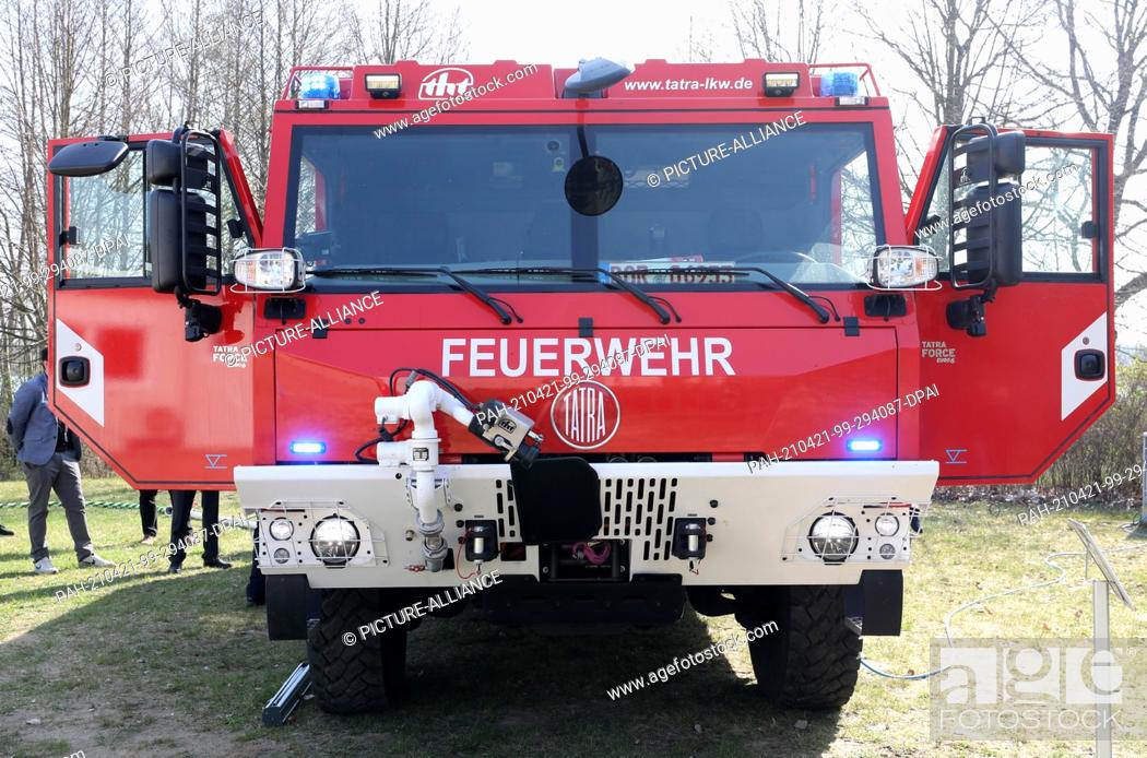 Stock Photo: 21 April 2021, Mecklenburg-Western Pomerania, Malchow: A new water tender is presented at a press event at the State Fire Brigade School.
