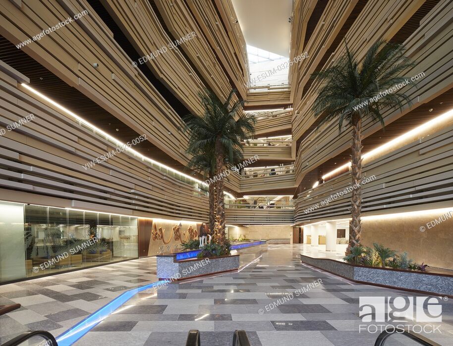 Stock Photo: Overall atrium view early dusk. National Bank of Oman HQ, Muscat, Oman. Architect: LOM Architecture and Design, 2017.