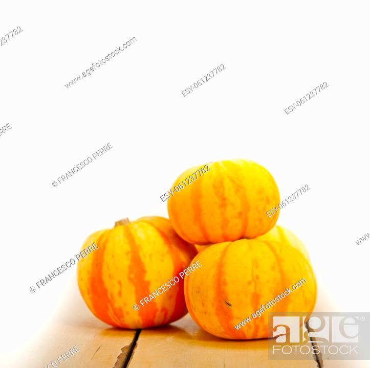Stock Photo: bunch of fresh yellow pumpkins just collected from garden.