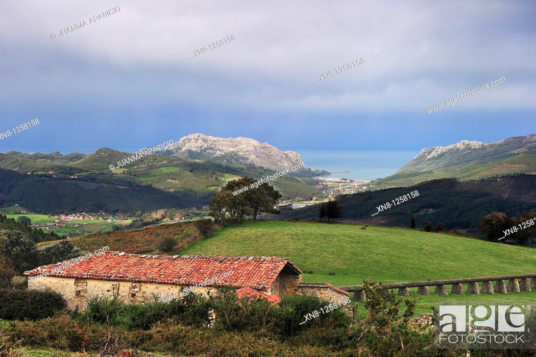 Stock Photo: Bacuna won Shack at the top of El Juncal (Guriezo Valley) at the bottom you can see the Cantabrian coast with Oriñon Tawn.