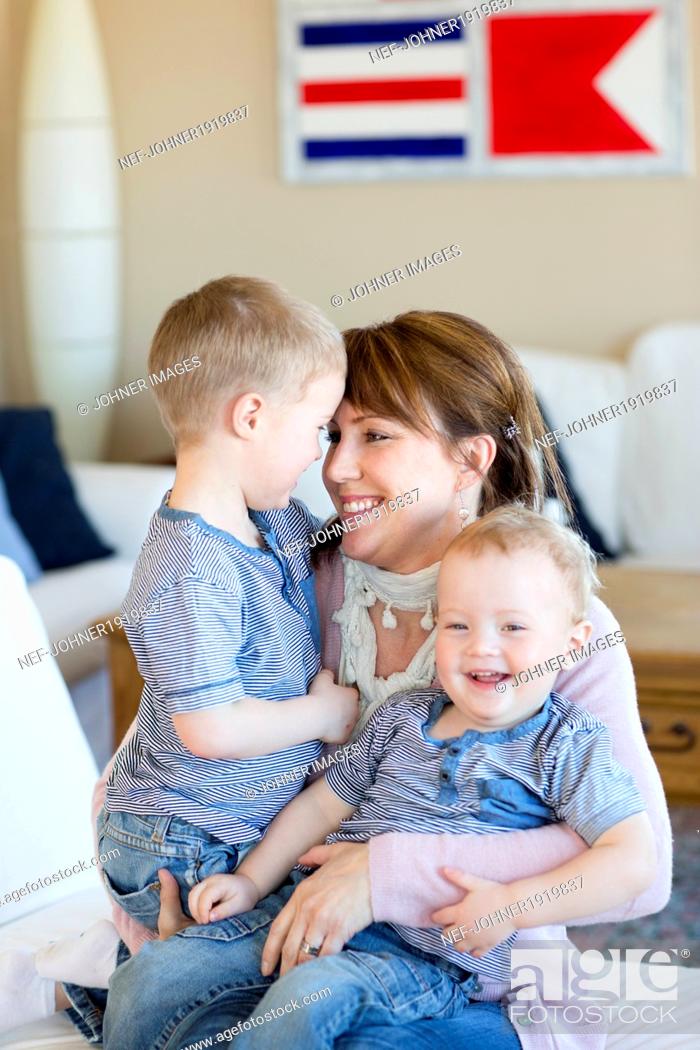 Stock Photo: Happy mother with two sons.