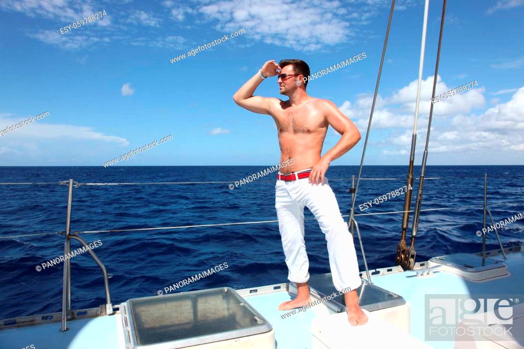 Stock Photo: Man enjoying summer time holiday on sailing boat.