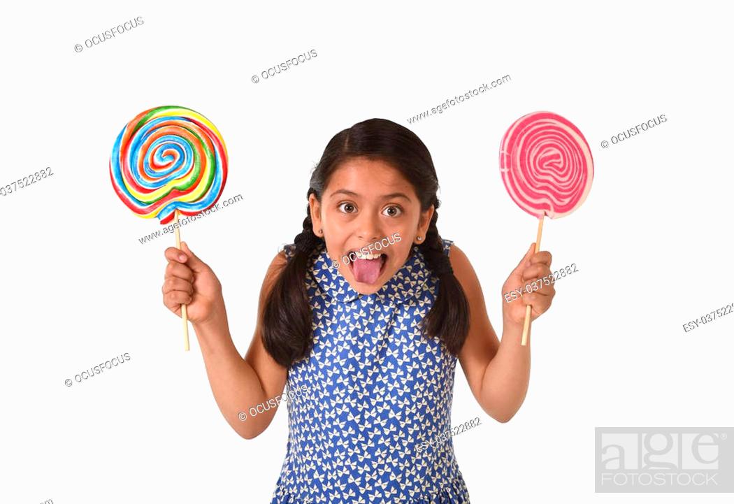happy female child wearing dress holding two big lollipop in crazy funny  face expression in sugar..., Stock Photo, Picture And Low Budget Royalty  Free Image. Pic. ESY-037522882 | agefotostock