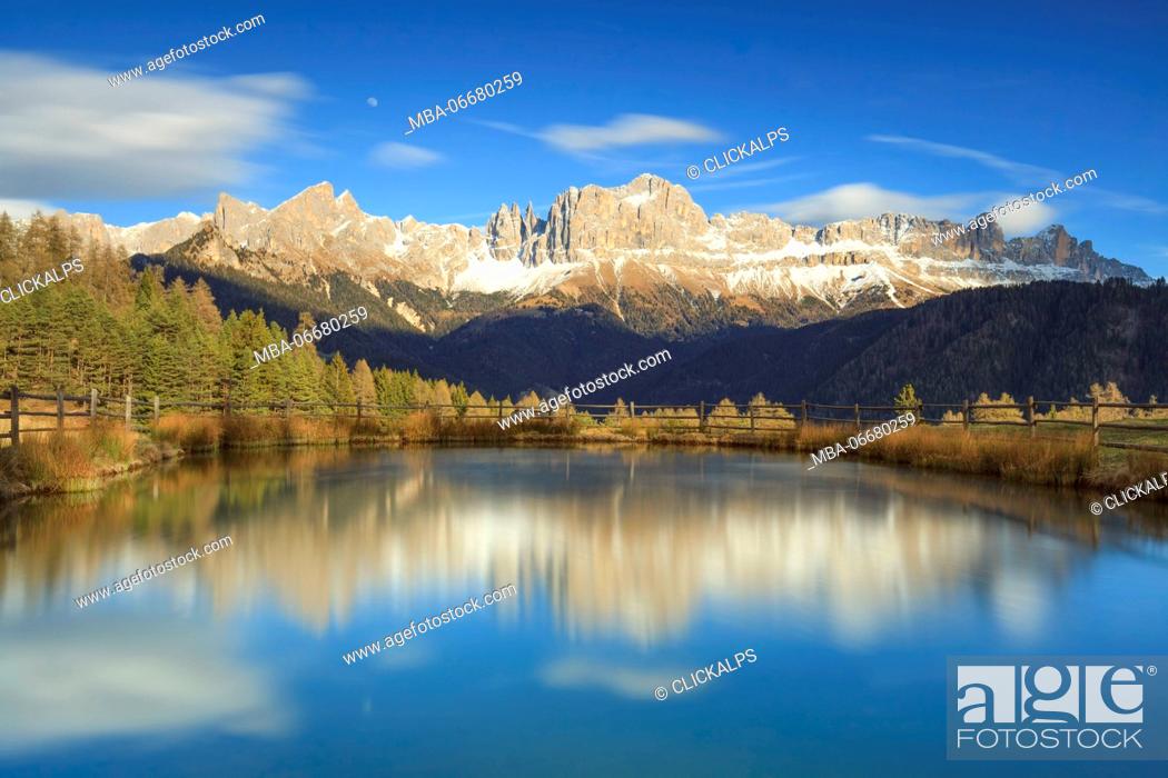 Stock Photo: Europe, Italy, Valley of Tiersertal, South Tyrol, Alto Adige, Dolomites. Reflections of Catinaccio - Rosengarten at sunset on the lake Wuhn.