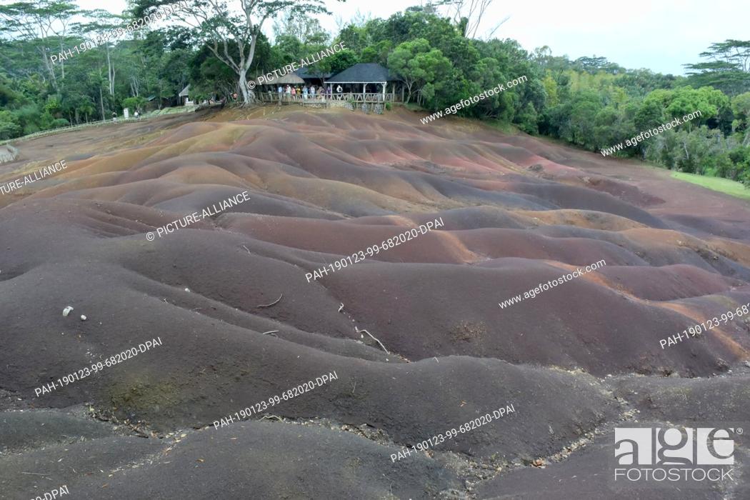 Stock Photo: 14 November 2017, Mauritius, Chamarel: The Colored Earth of Chamarel (Terres des 7 Couleurs) lies in different hills and shimmers in seven different colors near.