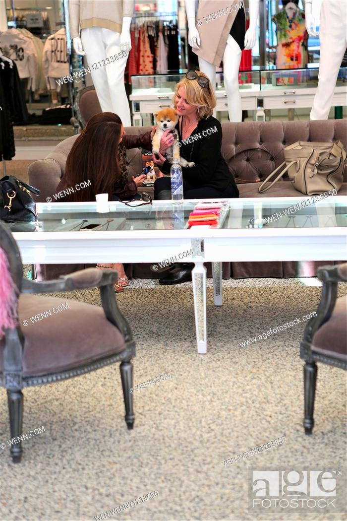 Stock Photo: Kyle Richards enjoys the company of Gentleman Norman in her Kyle store in Beverly Hills along with Laura Martella, owner of Gentleman Norman.