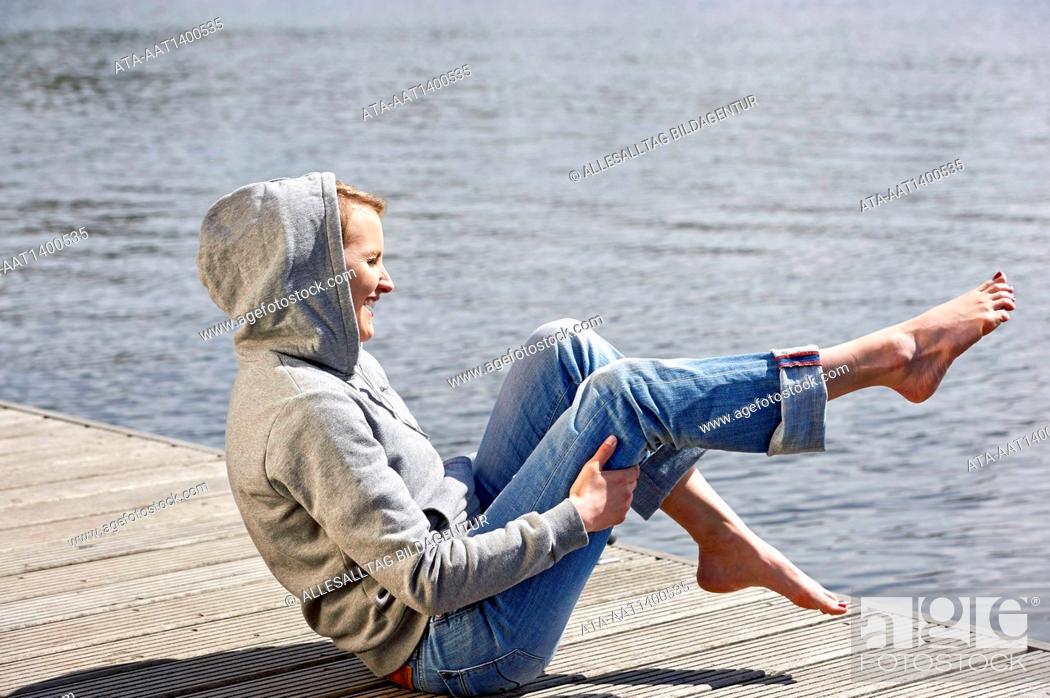 Stock Photo: Frau with cramp in the legs.