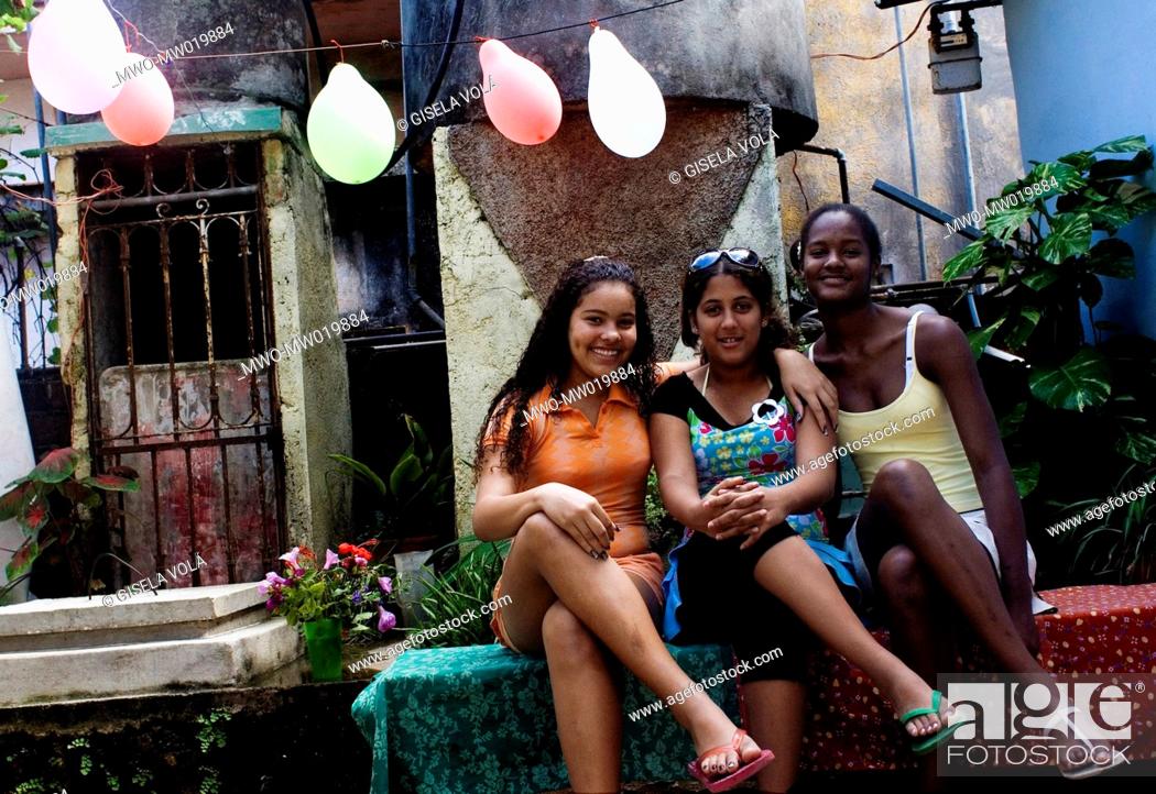 Young girls posing before the camera Havana City.