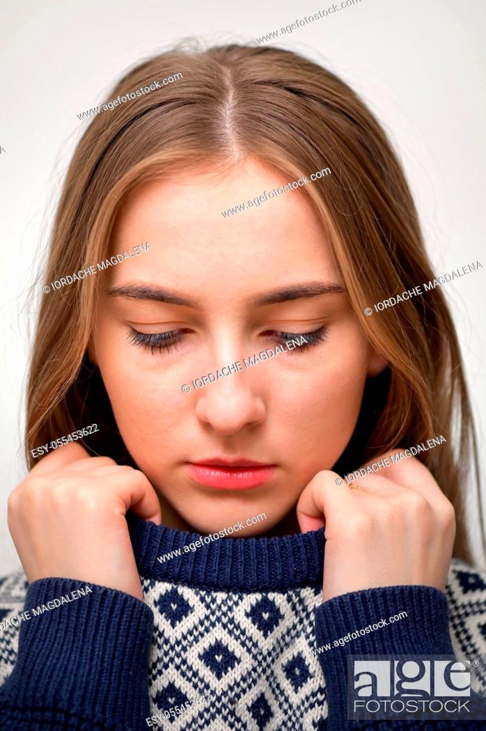 Stock Photo: young woman, serious, look down.