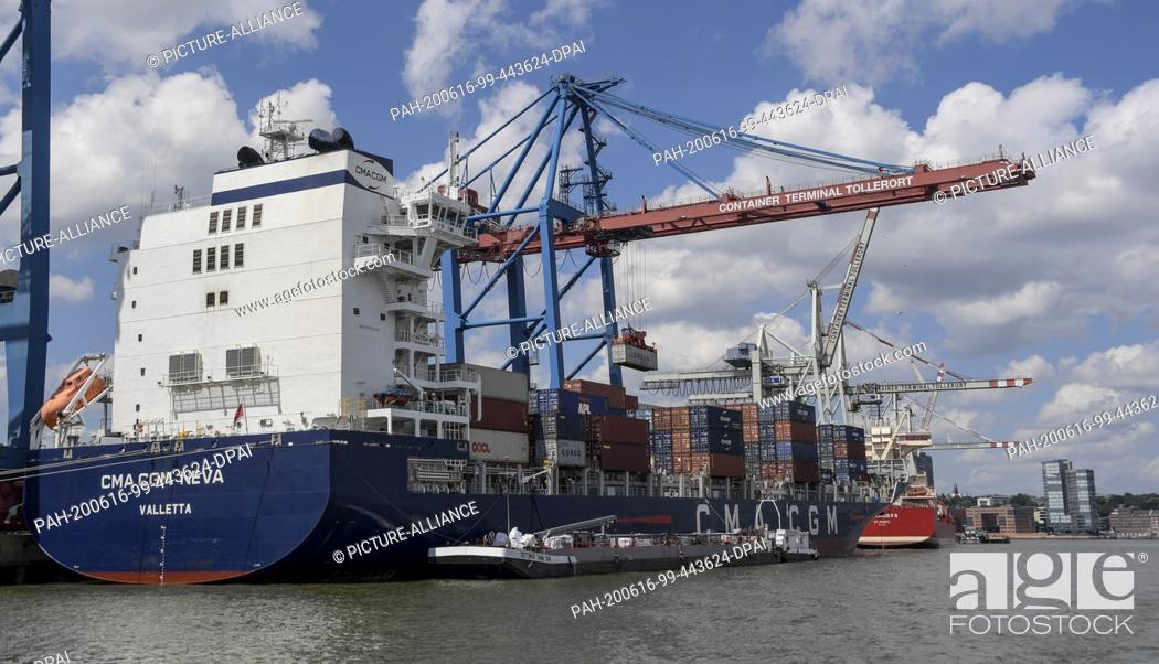 Stock Photo: 15 June 2020, Hamburg: The container freighter ""CMA CGM Neva"" is unloaded at the Tollerort terminal. Hamburg's exports fell sharply in the first three months.