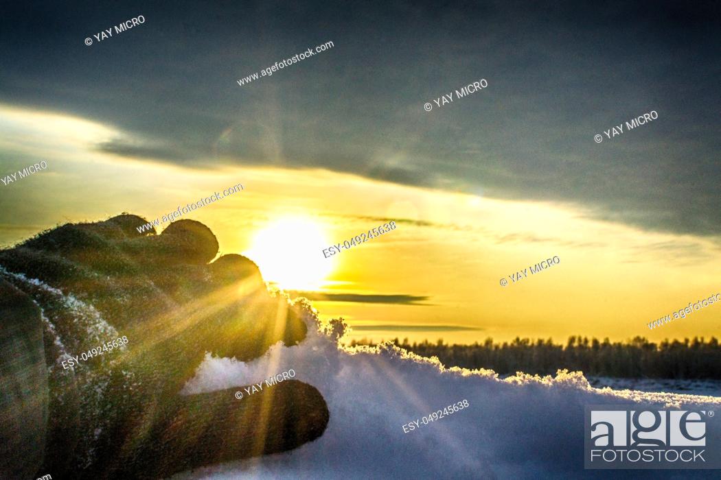 Stock Photo: Hands with a beautiful sky winter sunset on the river.