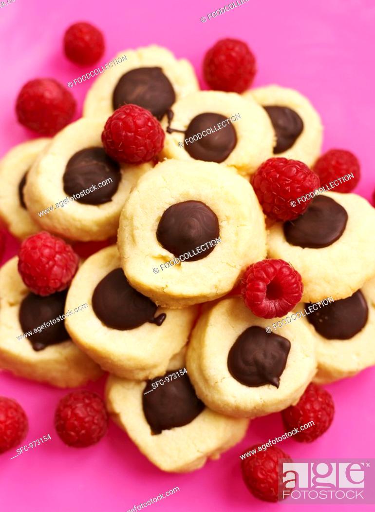 Stock Photo: Biscuits with chocolate and raspberries.