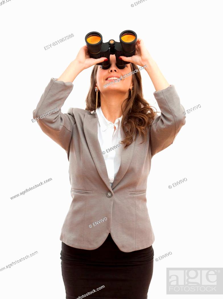 Stock Photo: Portrait of a beautiful young brunette businesswoman with seeking with binoculars.