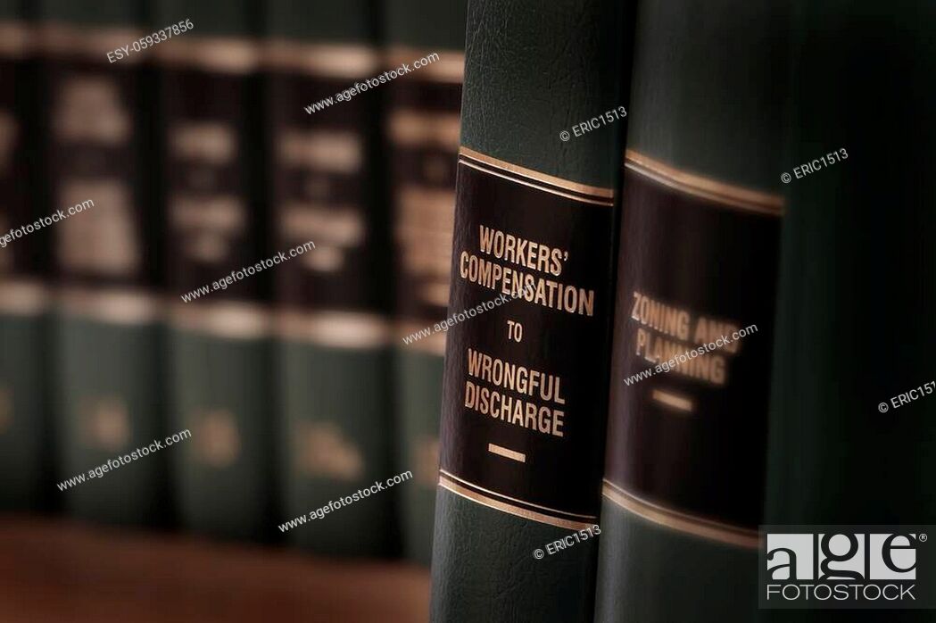 Stock Photo: Workers compensation law books injured on the job and seeking help.