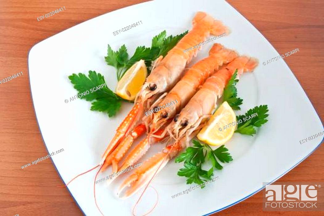 Stock Photo: prawns with lemon and parsley.