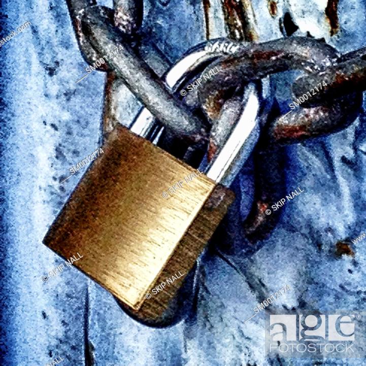 Stock Photo: Closeup of a padlock and chain.