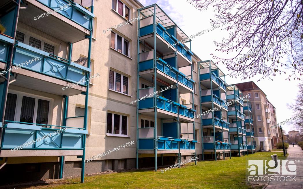 Stock Photo: 28 April 2021, Mecklenburg-Western Pomerania, Pasewalk: Prefabricated apartment blocks built in the GDR era in the city centre.