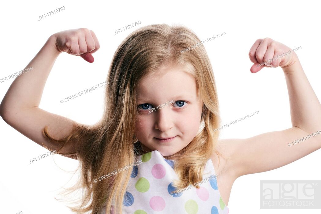 A young girl with blond hair shows her muscles on a white background, Stock  Photo, Picture And Royalty Free Image. Pic. DPI-12516790 | agefotostock