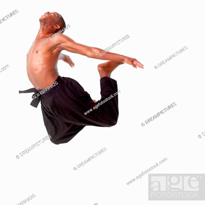 Stock Photo: Young man in mid air.