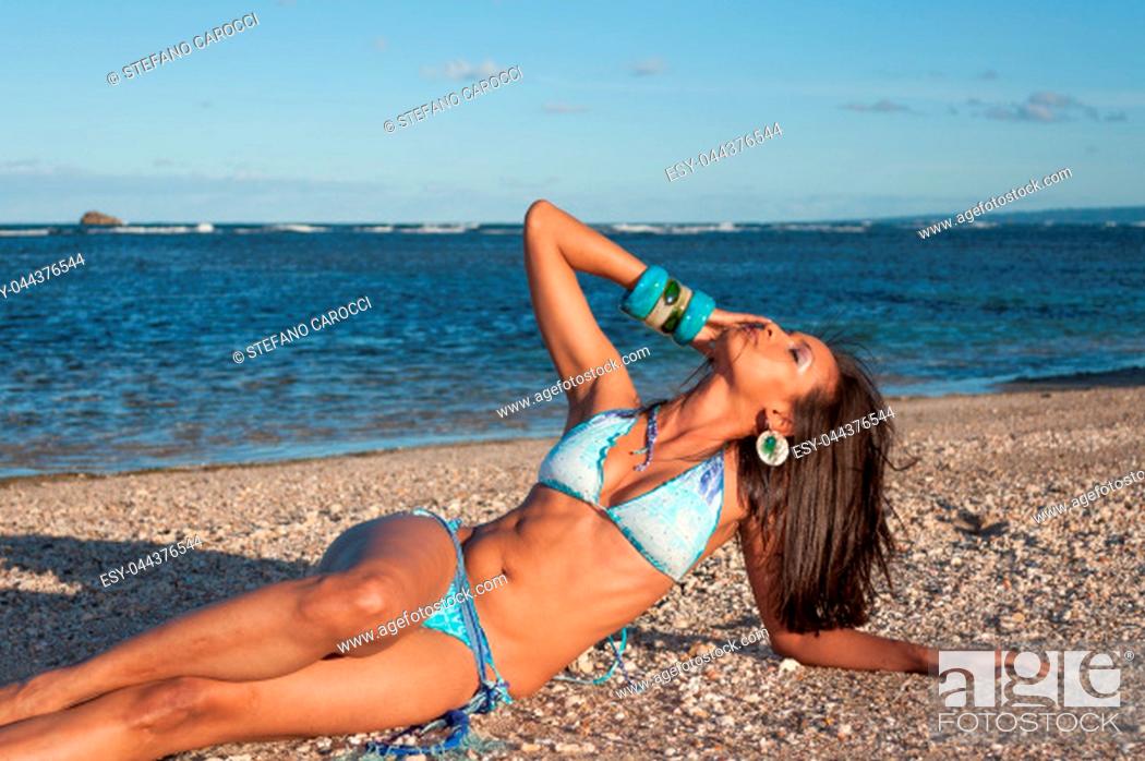 Stock Photo: Beautiful and sexy girl posing at the beach in dominican republic dressing a bikini.