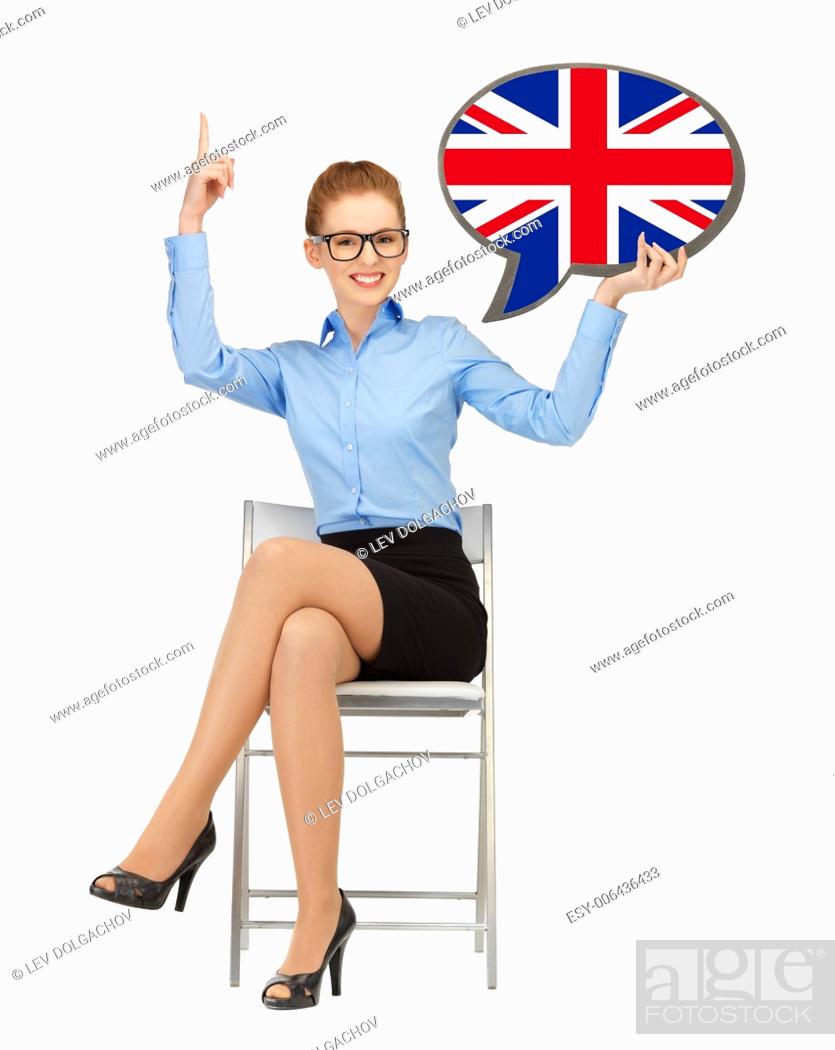 Imagen: education, foreign language, english, people and communication concept - smiling woman holding text bubble of british flag and pointing finger up.