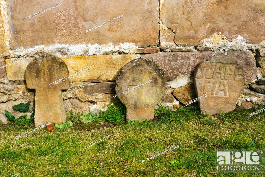Imagen: Remains of an ancient cemetery with discoid steles. courtyard of Church of the Assumption, Etxalar, Cinco Villas, Bortziriak, Navarre, Spain, Europe.