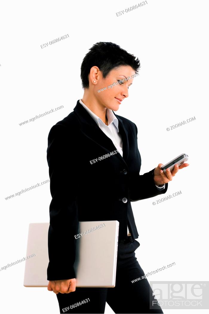 Stock Photo: Happy businesswoman with mobile phone and laptop computer, smiling, isolated on white.