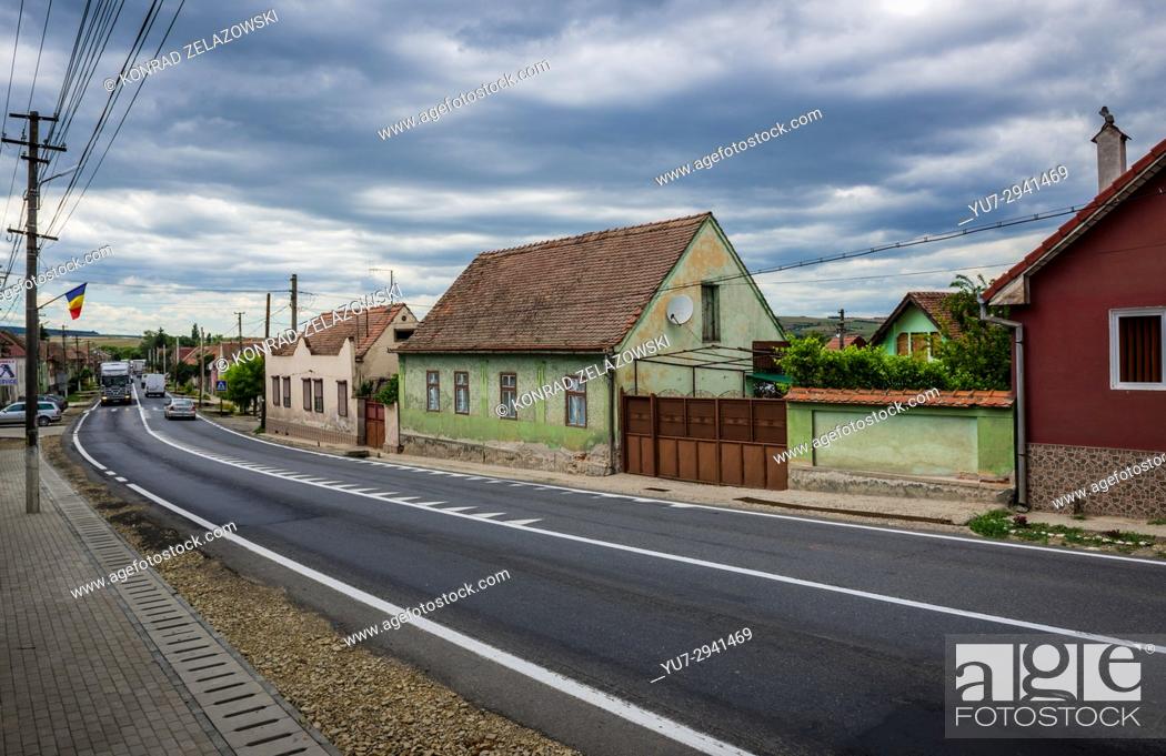 Stock Photo: Row traditional Saxon-style houses along main road in Miercurea Sibiului town of Sibiu County in southern Transylvania, Romania.