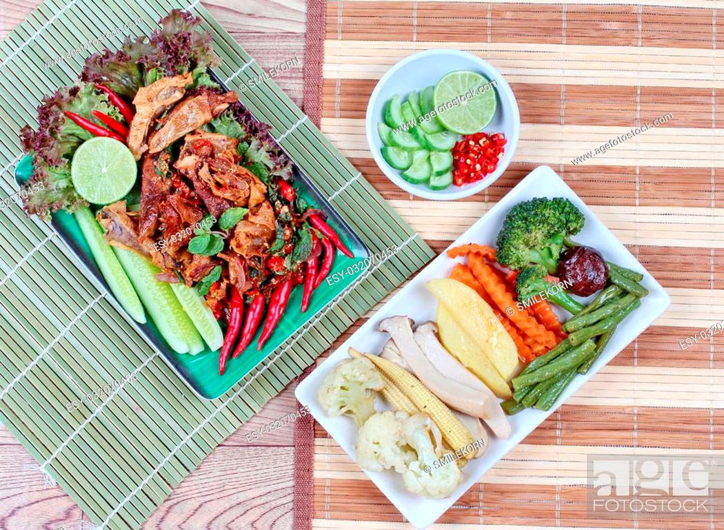 Imagen: Spicy and sour mixed herb salad with fried stir taro in tofu sheet and fried mixed vegetables served with side dish are food for Vegetable festival of Chinese.