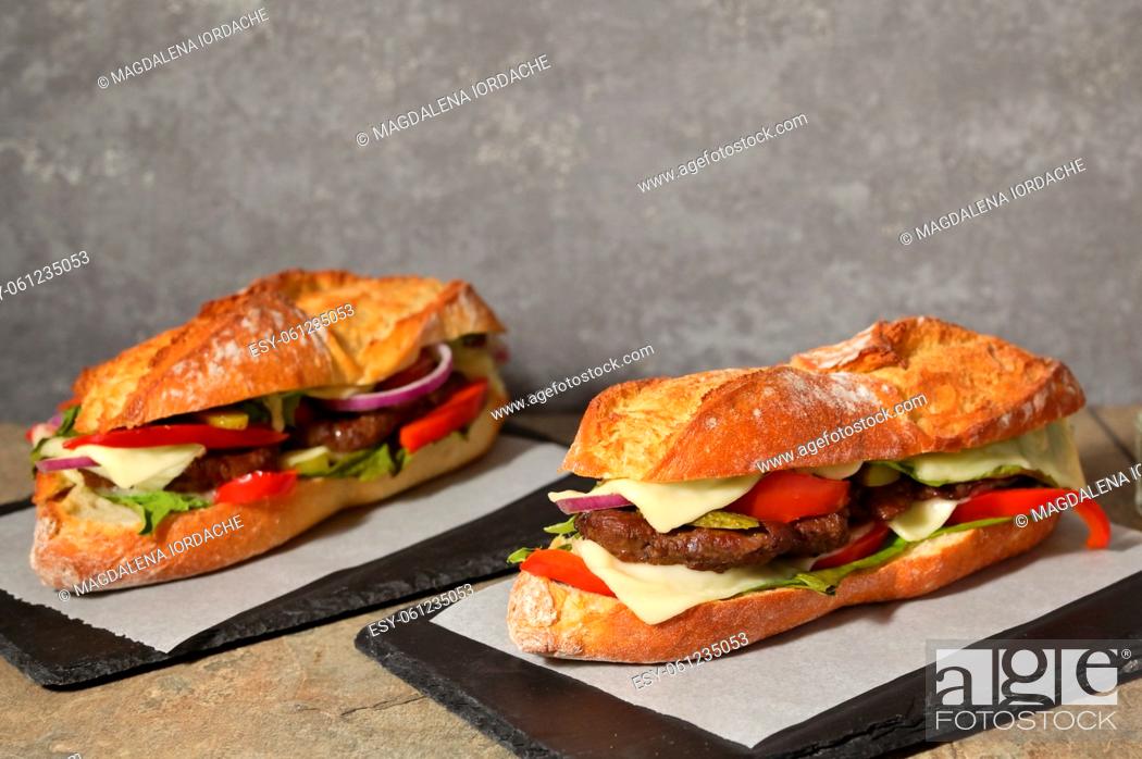 Stock Photo: Homemade Burger with Baguette Bread on the wooden table.