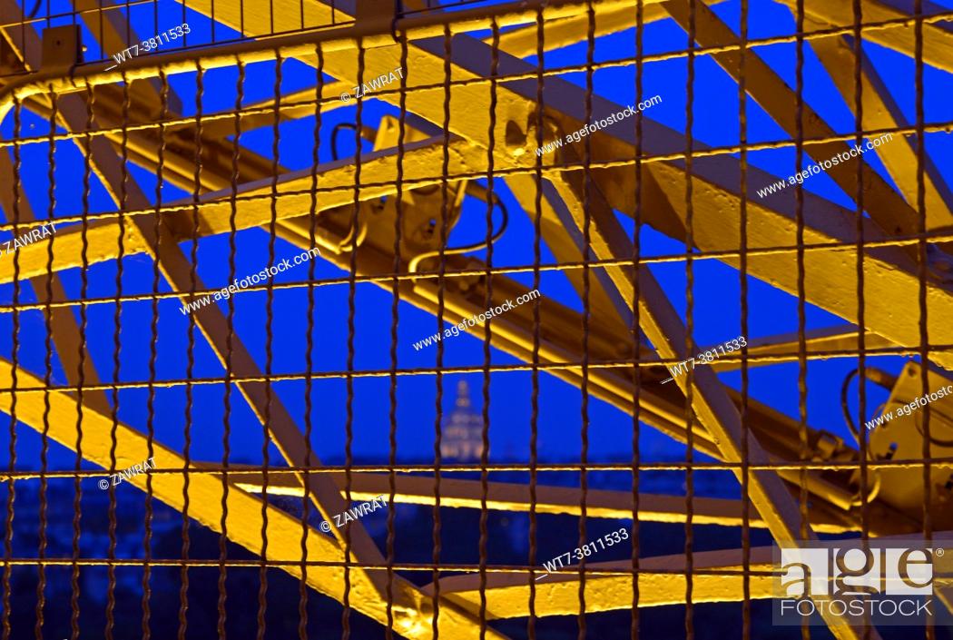 Stock Photo: Eiffel Tower, inside view, steel structure, evening, lighting, lamps, city by night.