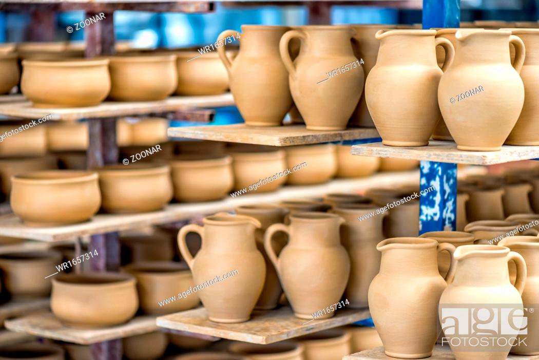 Stock Photo: Shelves with ceramic dishware.