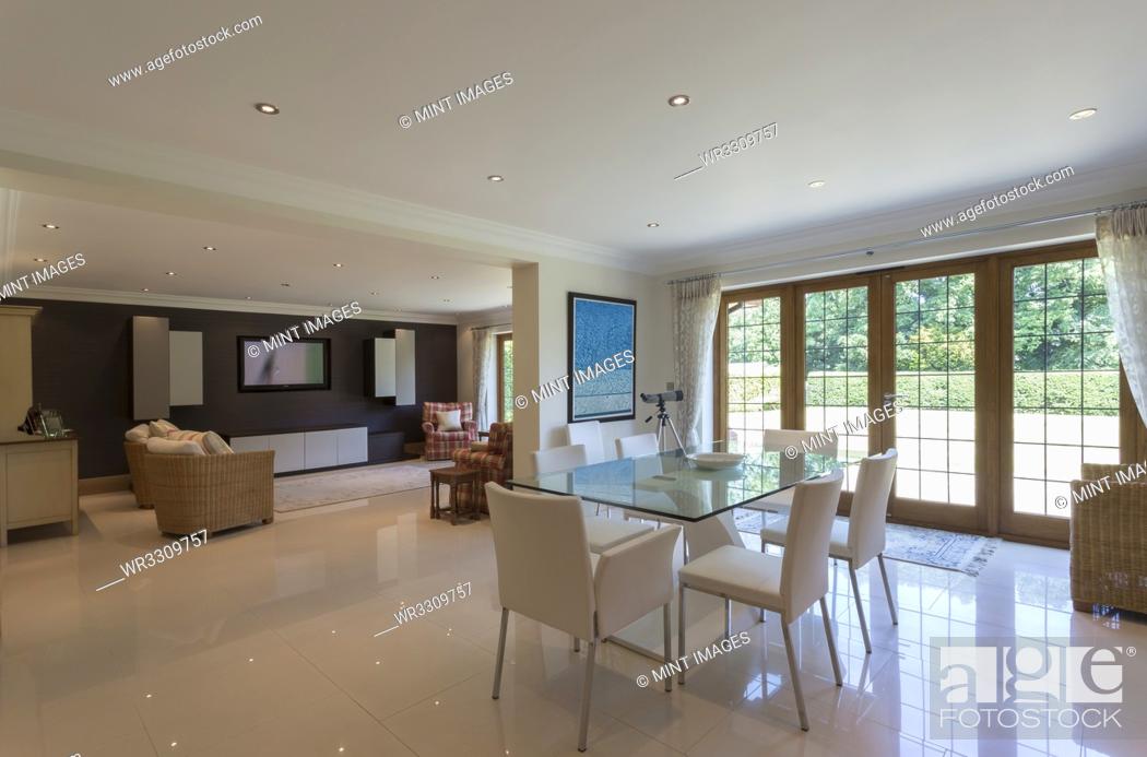 Stock Photo: Dining room and living room in modern house.
