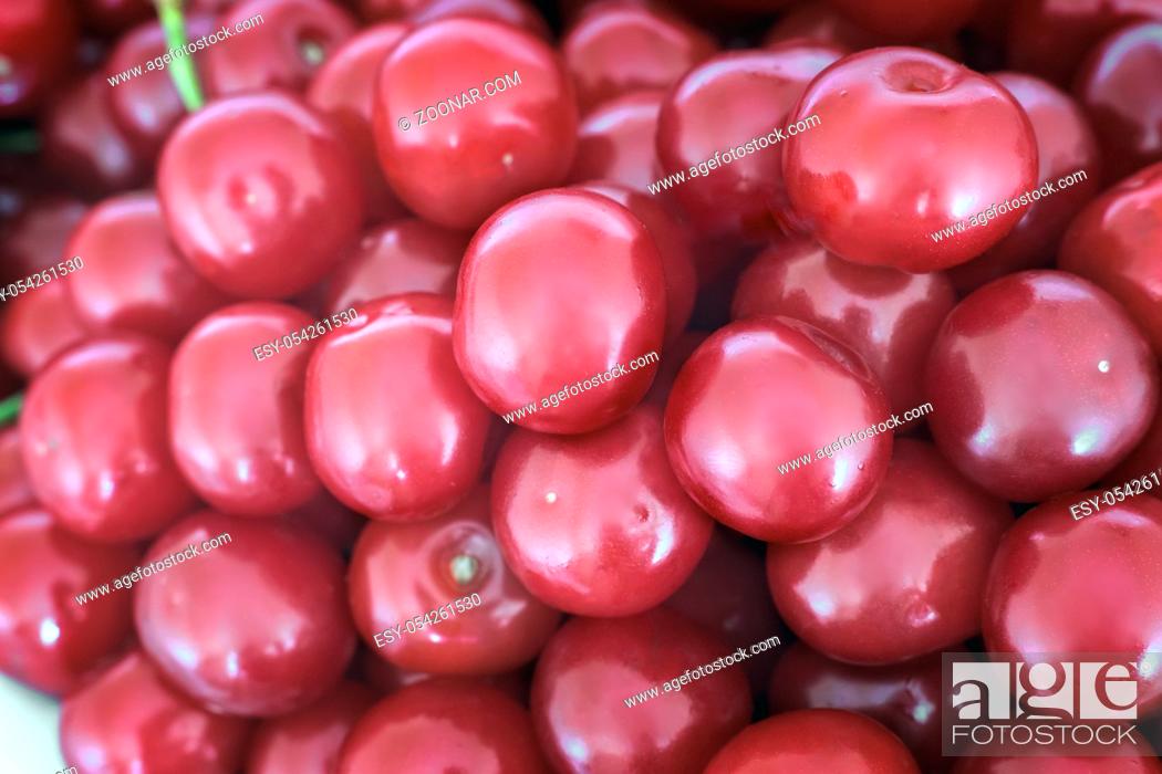Stock Photo: A large number of large ripe cherries with stalks background image.
