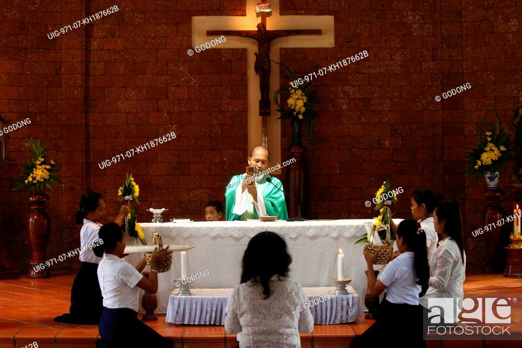 Stock Photo: Sunday mass at Battambang catholic church.