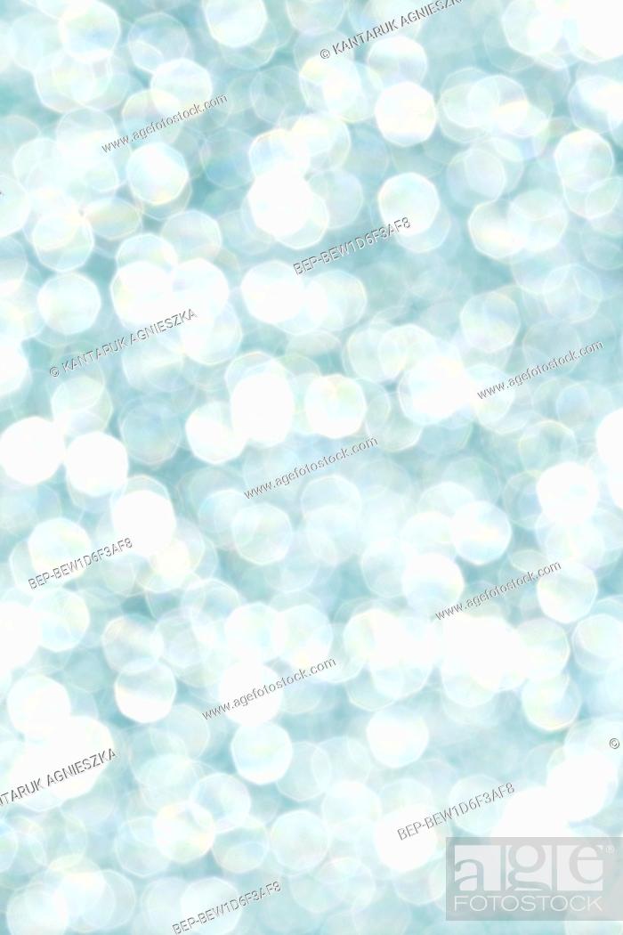 Stock Photo: Blue glittering lights. Blurred abstract background. Graphic resources.