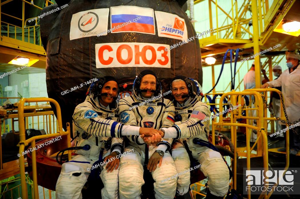 Stock Photo: In the Integration Facility at the Baikonur Cosmodrome in Kazakhstan, the Expedition 53-54 crewmembers pose for pictures Aug.