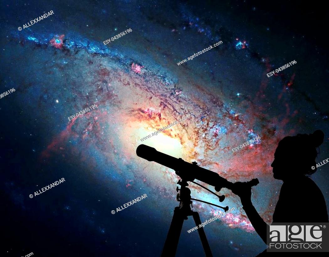Stock Photo: Girl looking at the stars with telescope. Spiral Galaxy M106, in the constellation Canes Venatici. Elements of this image are furnished by NASA.