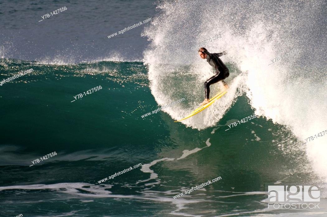 Stock Photo: surfer by becoming a re-entring in Paul do Mar in Madeira.