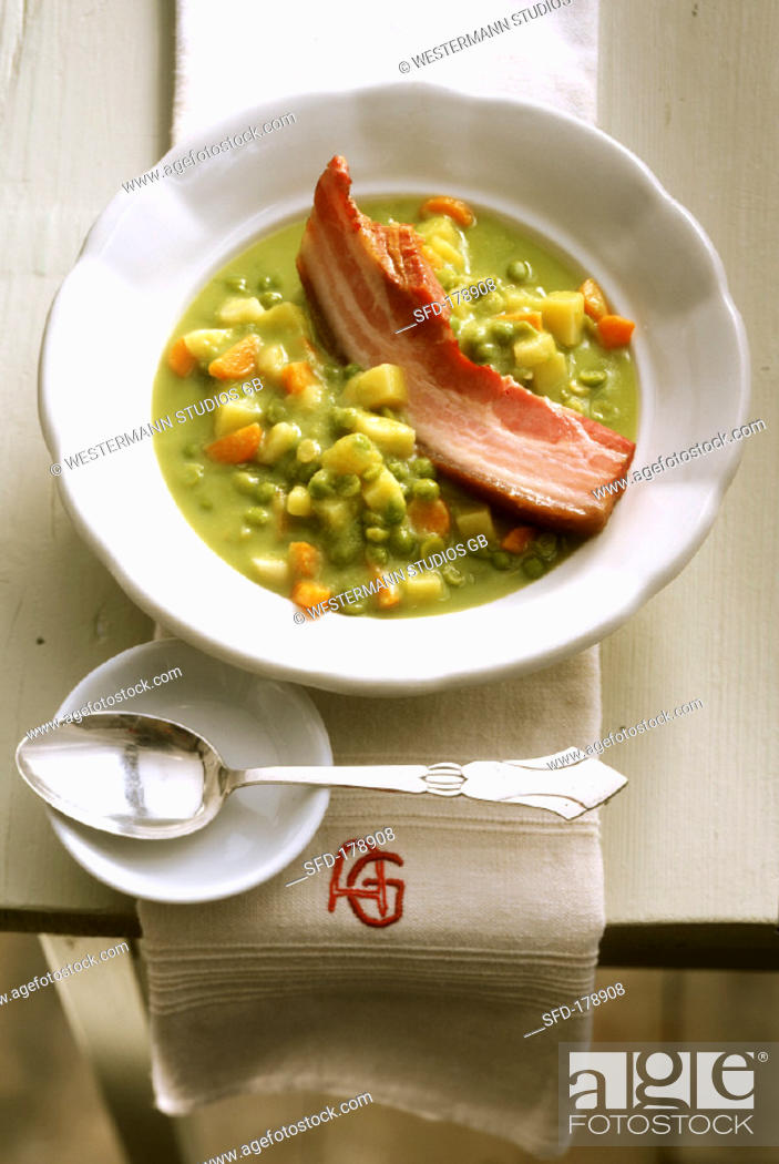 Stock Photo: Pea soup with root vegetables, potatoes and belly pork.