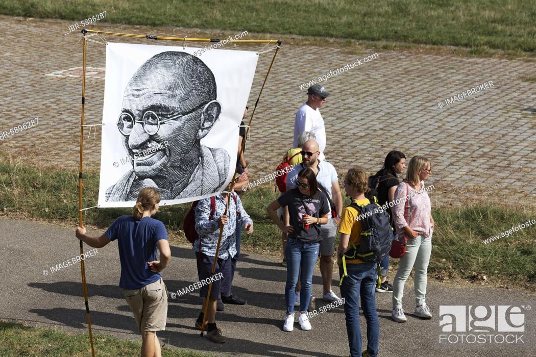 Stock Photo: Demo against corona rules on the Rhine meadows, banner with portrait of Mahatma Gandhi, Düsseldorf, North Rhine-Westphalia, Germany, Europe.