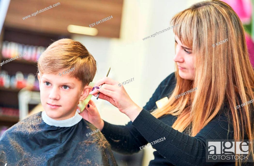 Child haircut. Barber or hair stylist at work. Hairdresser cutting hair of  boy client with scissors, Stock Photo, Picture And Low Budget Royalty Free  Image. Pic. ESY-041390324 | agefotostock