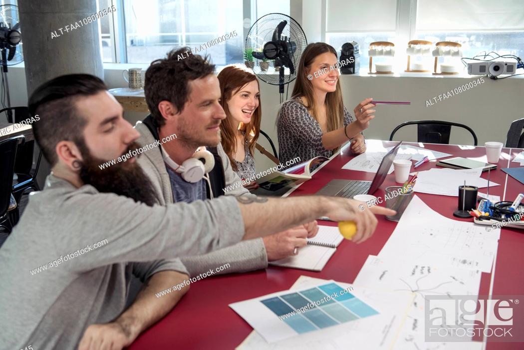 Stock Photo: Creative colleagues brainstorming in meeting.