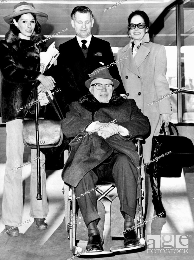 Stock Photo: Aug. 30, 1973 - London, England, U.K. - British actor CHARLIE CHAPLIN (in wheelchair) with his wife OONA (right) and daughter GERALDINE (left) on the Heathrow.